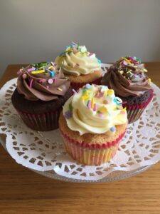 Chocolate cupcakes covered with chocolate buttercream and sprinkles