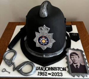 police hat cake with handcuffs and truncheon