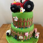 2 tier farmyard cake with modelled animals and tractor