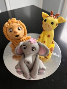 modelled lion, giraffe and elephant made from modelling paste